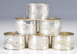 Set of six Chinese silver napkin rings engraved with decoration of dragons and marked silver, weight