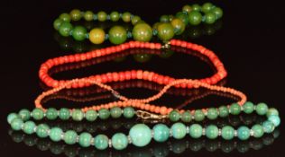 Four beaded necklaces comprising Bakelite, two coral and one turquoise and crystal