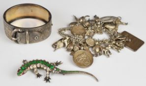 A hallmarked silver bangle (London 1865) in a buckle design with engraved ivy decoration, sterling