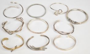 Ten silver bangles, 165g