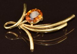 An 18k gold brooch set with an oval cut citrine, 6g, 4.4 x 3.2cm