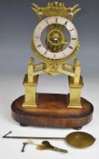 Brass framed fusee skeleton clock of lyre design with silvered dial and Roman numerals, raised on