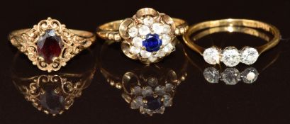 An 18ct gold ring set with three diamonds (1.7g, size P), and two 9ct gold rings, one set with a