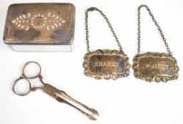 Hallmarked silver items comprising pair of sugar nips, two bottle tickets and a silver topped