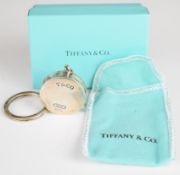 Tiffany & Co hallmarked silver tape measure, dated to side 2002, in original box and pouch