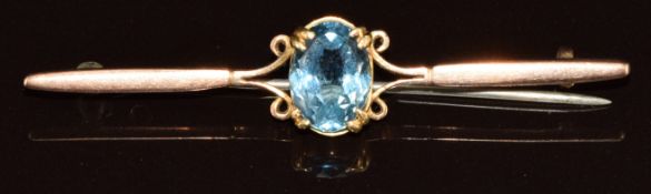 A 9ct gold brooch set with oval cut blue glass, 3.8g