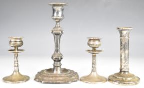 Four hallmarked silver candlesticks including a pair of Walker & Hall examples, height of tallest
