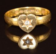 A Victorian 22ct gold ring mounted with a heart set with a diamond in a star setting, 2.5g, size N