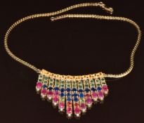 A 9ct gold necklace set with fifty six fancy sapphires totalling 16.4ct, fourteen rubies total 7.1ct