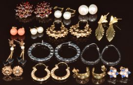 Fourteen pairs of 9ct gold earrings including pearls, coral, hematite, white gold, hoops,