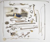 A collection of jewellery including three silver clips, five silver T bars, two silver padlock
