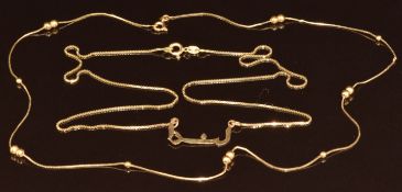 Two 18k gold necklaces, one with sphere decoration and the other a name in Arabic, 6.4g, 44 & 48cm