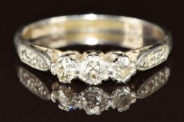 A platinum ring set with three old cut diamonds and two further diamonds to the shoulders, 3.8g,