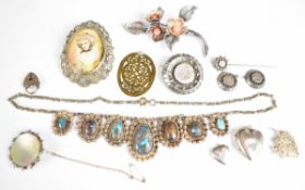 A collection of silver jewellery including Charles Horner brooch, Victorian brooch with shamrock and