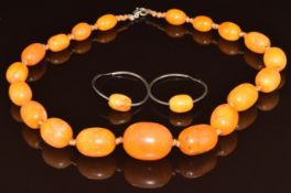 Baltic amber necklace made up of nineteen graduated oval beads, smallest bead 9.6 x 13.6mm,