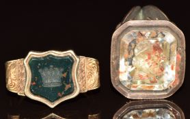 Victorian signet ring set with a carved bloodstone intaglio and a Victorian yellow metal intaglio