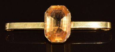 A 15ct gold brooch set with an emerald cut citrine, 6.8g, 5cm