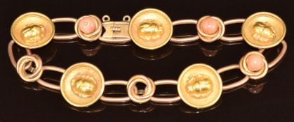 A 19thC 9ct gold bracelet made up of circular links with scarab decoration in relief and knotted