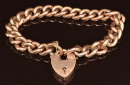 A 9ct rose gold curb link bracelet with heart padlock clasp, 20.6g, 18cm