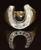 A 10k gold ring in the form of a horseshoe set with diamonds, 4.1g, size M