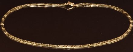 A 14k gold necklace made up of Greek key rectangular links, 13.1g