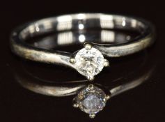 An 18ct white gold ring set with a round cut diamond measuring approximately 0.25ct