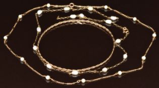 A 9ct gold bangle and two 9ct gold necklaces