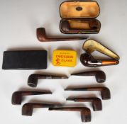 A collection of vintage used smoker's pipes including hallmarked silver mounted 'Who' with amber