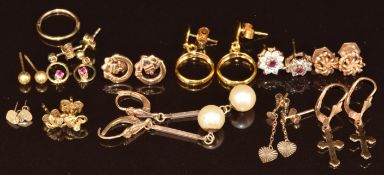 Ten pairs of 9ct gold earrings including hearts, ruby and cubic zirconia, crosses, etc, 13.6g
