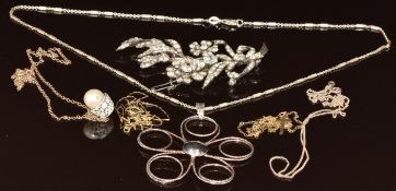 A silver brooch set with paste, two silver necklaces and two 9ct gold chains and cross pendant (0.