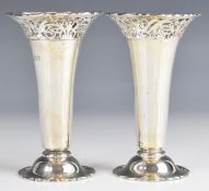 Pair of Elizabeth II hallmarked silver trumpet vases with pierced rims, London, date letters rubbed,
