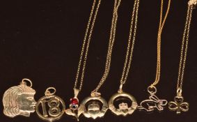 Five 9ct gold chains and seven 9ct gold pendants including garnet, shamrock, rabbit, claddagh,