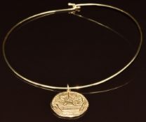 A 14k gold 'hog' penny pendant (3cm) on 14k gold necklet, 26.7g