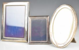 Three hallmarked silver photograph frames, the largest to suit 5 x 3½ inch photo, one being oval and