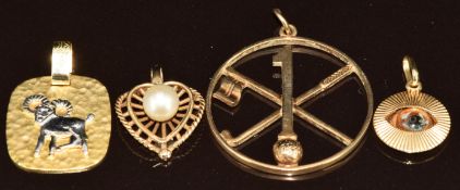 A 14k gold Aries pendant (3g), 9ct gold gold in one pendant (3.6g), yellow metal eye pendant (1g)