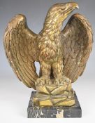 Gilt model of an eagle, on square marble base, overall height 25cm