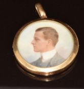 A 15ct rose gold locket set with an ivory portrait miniature of a gentleman, marked to lower rim