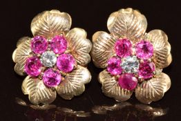 A pair of 9ct gold earrings of floral design each set with a diamond of approximately 0.15ct
