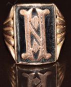A rose gold ring set with black enamel and a gold 'H', 4.7g, size M