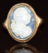 Georgian yellow metal ring set with a wax portrait miniature silhouette, 8.4g, size Q