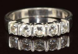 A platinum ring set with five round cut diamonds each approximately 0.15ct,the total diamond