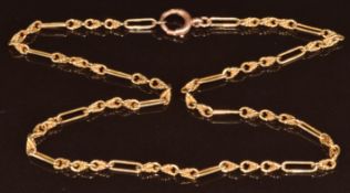 A c1910 9ct gold necklace made up of elongated and knotted links, 9.8g, 41cm