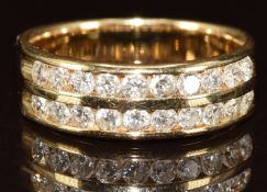 A 14k gold ring set with two rows of round cut diamonds, the total diamond weight approximately 0.