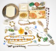 A collection of costume jewellery including Art Deco beaded necklaces, vintage brooches including