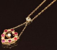 A c1900 15ct gold necklace in the form of a heart set with rubies, a pearl and old cut diamonds, 4.