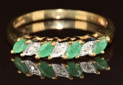 A 9ct gold ring set with marquise cut emeralds and diamonds, 2.5g, size O
