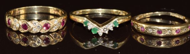 Three 9ct gold rings, two set with rubies and diamonds, and the other emeralds and diamonds (one