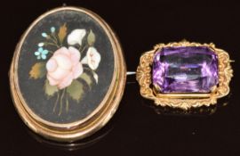 A 9ct gold brooch set with a mixed cut amethyst (9.8g, 2.8 x 2.2cm) and a yellow metal pendant/