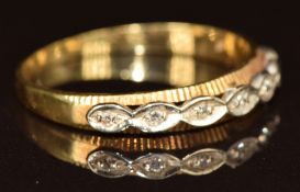 An 18ct gold ring set with seven diamonds, 2.3g, size P