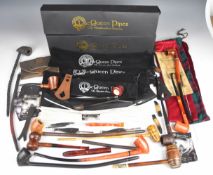 Large collection of American long stem corncob style pipes including Golden Pipes, 'MacQueen